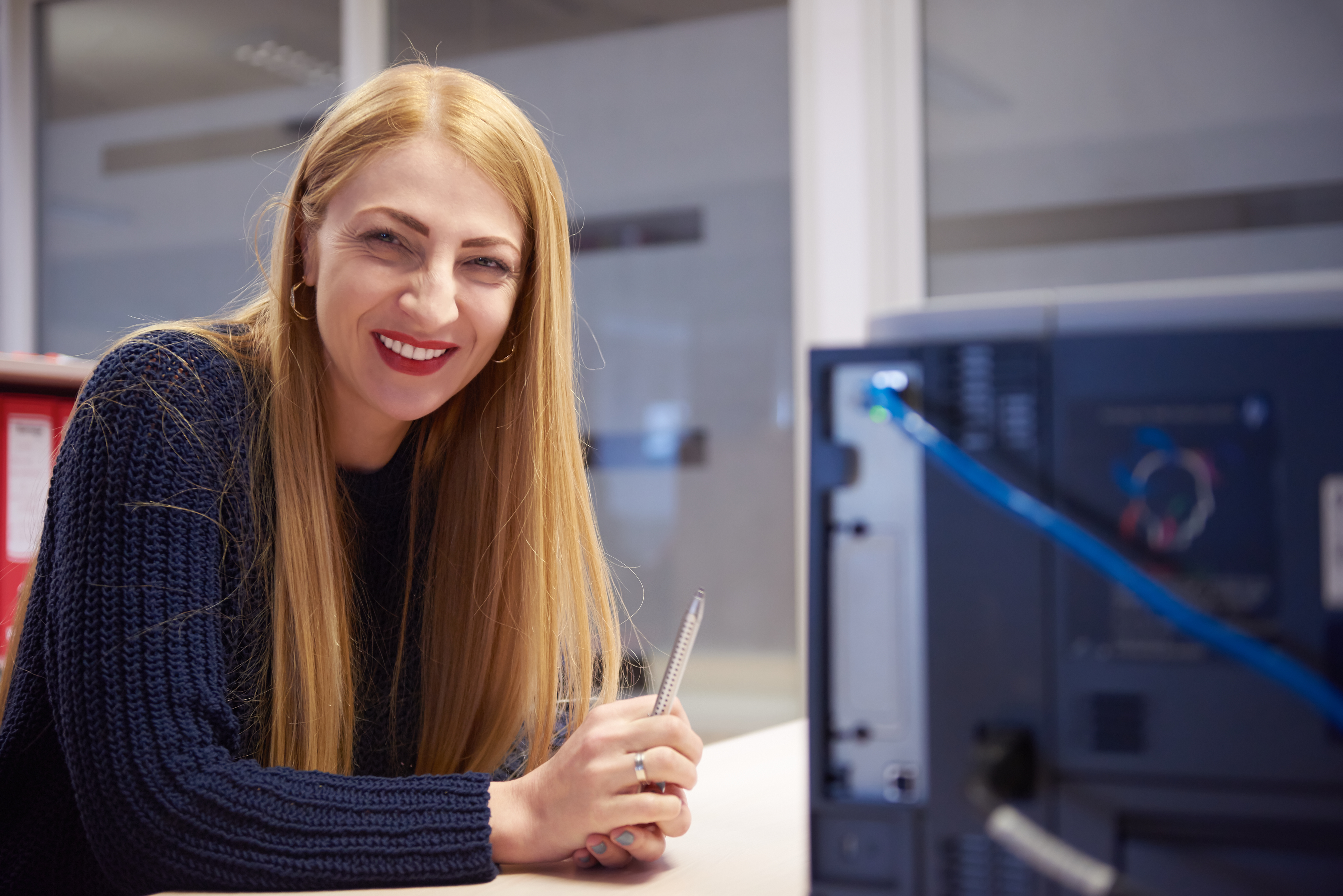 Woman alone with computer smiling