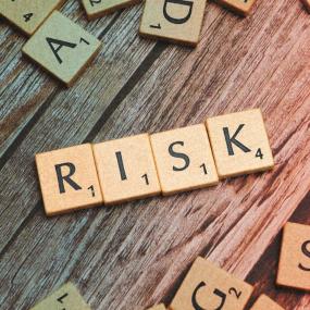 Risk spelled out in scrabble tiles