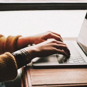 Person typing on a laptop