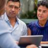 Colleagues consulting around an Ipad